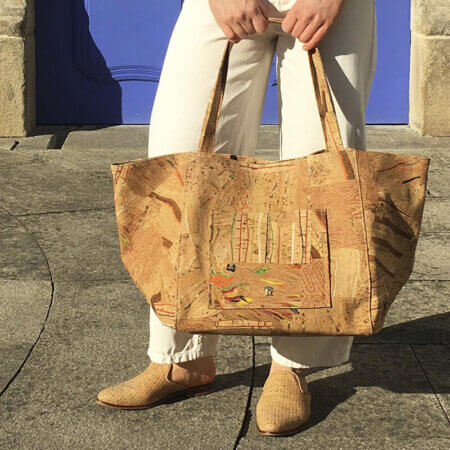 A woman with cork tote bag